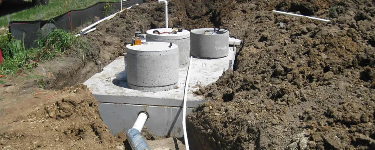 Septic system repair and installation site with tank access ports in Omaha, NE